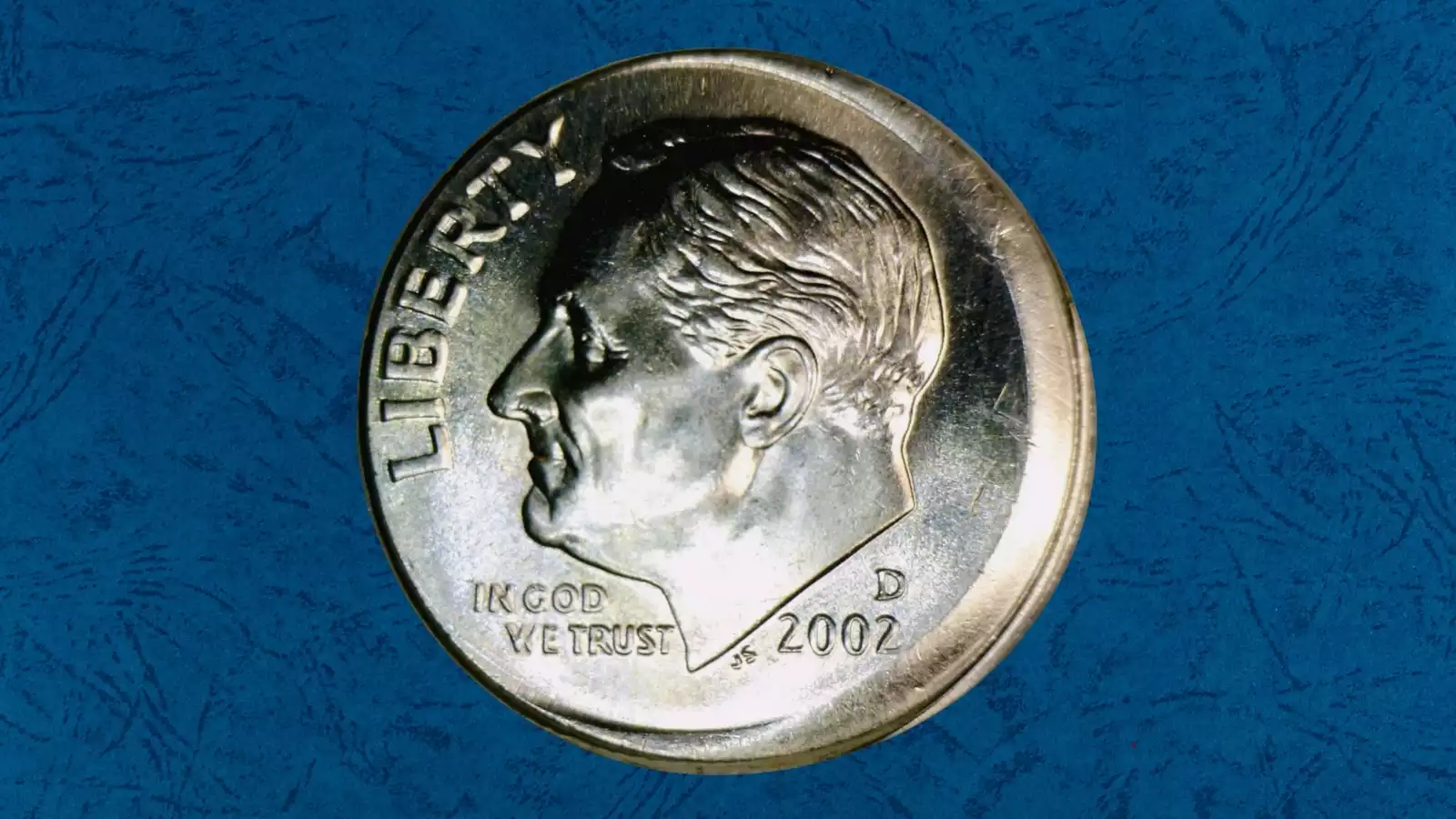 2002 dime off-center strike error with crescent of blank planchet visible