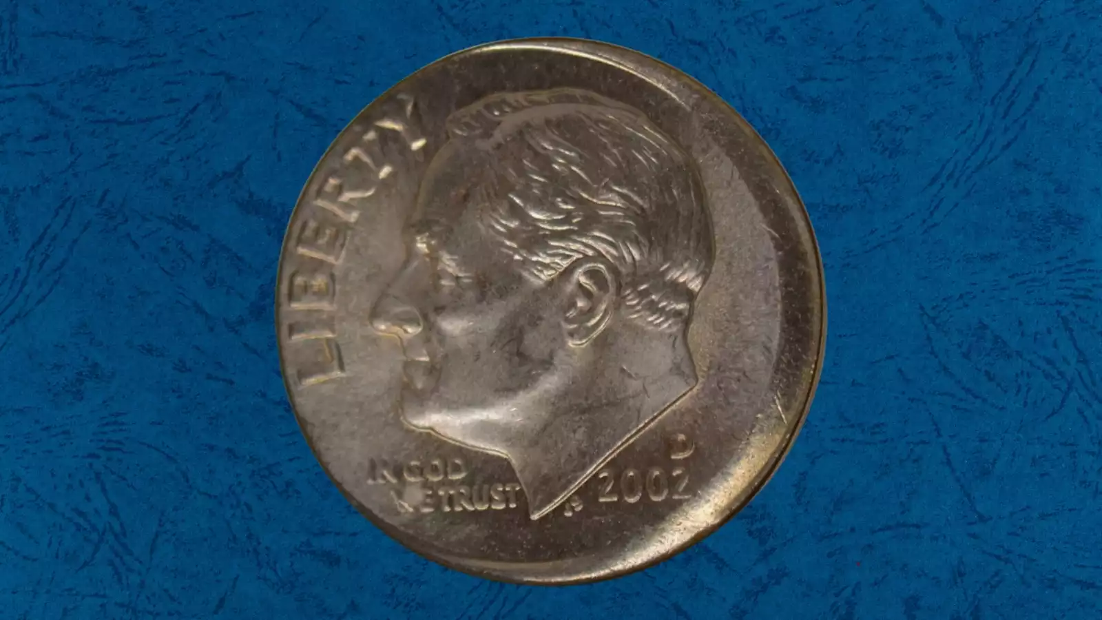 2002 dime broadstrike error showing expanded diameter and missing reeded edge